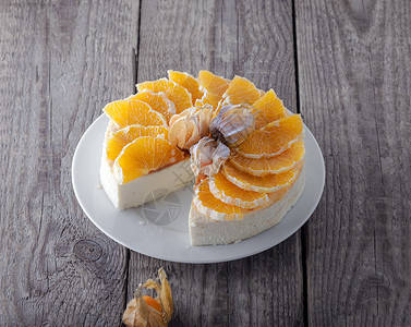 橙子味粗粮糕芝士蛋糕装饰着橙子和植物 香薰 生日 不健康的饮食 财富背景