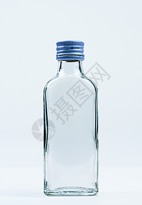 壁柜空带带封闭铝盖的空透明玻璃瓶隔离在白色背景上 带有空白标签和复制空间 用于饮料或医药产品设计模板 玻璃瓶包装背景