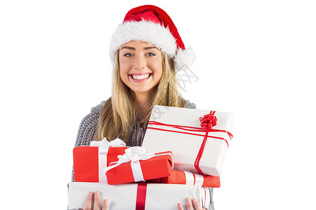 喜庆的金发女郎拿着一堆礼物 快乐的 微笑 快乐 圣诞帽背景图片