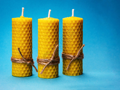 蜂窝蜡烛三支黄色蜂蜡蜡烛背景