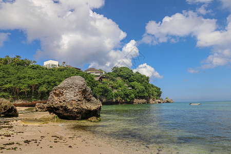 乌卢鲁巨石印度尼西亚巴厘岛巴东巴东海滩-自然度假背景 在印度洋上突出的巨石和岩层 乌鲁瓦图 太阳背景