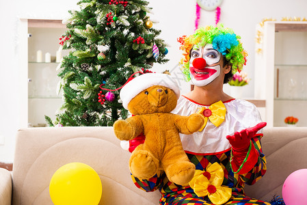 玩具小丑圣诞庆典中搞笑的小丑概念 漫画 熊 假发 娱乐背景