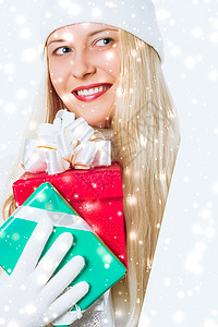 神奇的圣诞节和闪闪发光的雪背景 快乐的金发女郎 在冬季带着礼盒购物销售和度假品牌背景图片