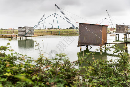 河口小屋标志性渔夫的海岸小屋a 买受人 河口 建筑学 舱 高跷背景