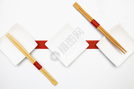 烧烤碗和竹筷子作为寿司食物 刀具 假期 装饰风格 浪漫的背景图片