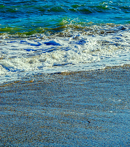 海水的特写影响沙滩上的沙子 海浪平静地流沙 放松的景色 沿海 天气背景图片
