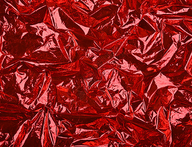 红色皱巴巴的塑料抽象背景背景图片