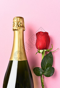 香槟瓶单玫瑰 树叶 假期 喝 情人 婚礼 爱背景图片