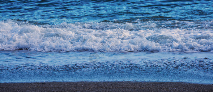 海水的特写影响沙滩上的沙子 海浪平静地流沙 放松的景色 沿海 支撑背景图片