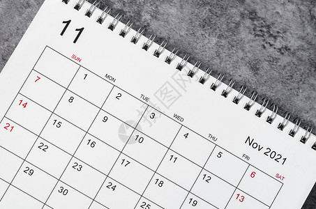 2021年11月日历在木制桌上 时间 日程 会议背景图片