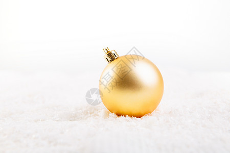 白底雪上闪雪的金色圣诞节舞会背景图片