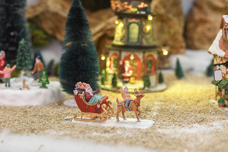 圣诞节展示背景圣诞老人骑着雪橇 带着陶瓷人物的圣诞礼物冬季场景背景