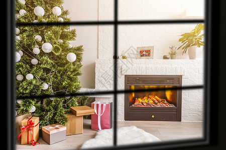 大气年会邀请函大气中的圣诞窗口 Xmas树 旋转木马 家 女士背景