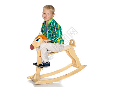 宝宝骑木马一个小男孩骑着木马 玩具 喜悦 工作室 可爱的 小马背景