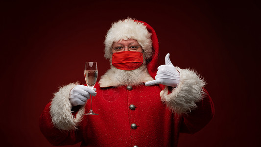圣诞老人干杯喝香槟的圣诞老人 老的 眼镜 香槟酒 男性 脸 病毒背景