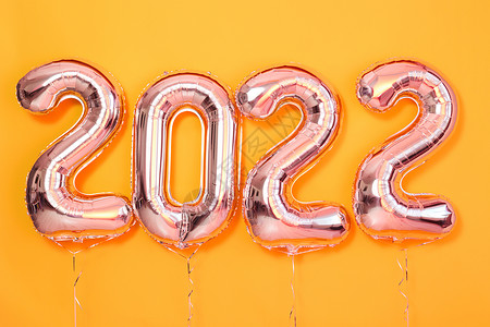 从以上数字气球新年快乐 对象将彩色黄色背景的圆珠化背景图片