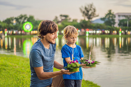 天猫跑步节父子游人庆祝 在水上奔跑 节 人们购买鲜花和蜡烛点燃并漂浮在水上庆祝泰国的节背景