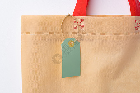 手提袋标签边框白色背景白纸袋上贴有叶包纸袋的空白纸标签 假期 购物包背景