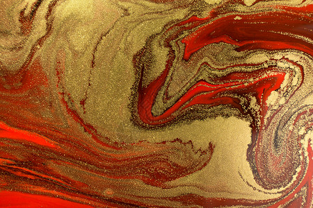 红色大理石深红色背景的金波浪 圣诞节 黑暗的 美丽的 假期 画背景