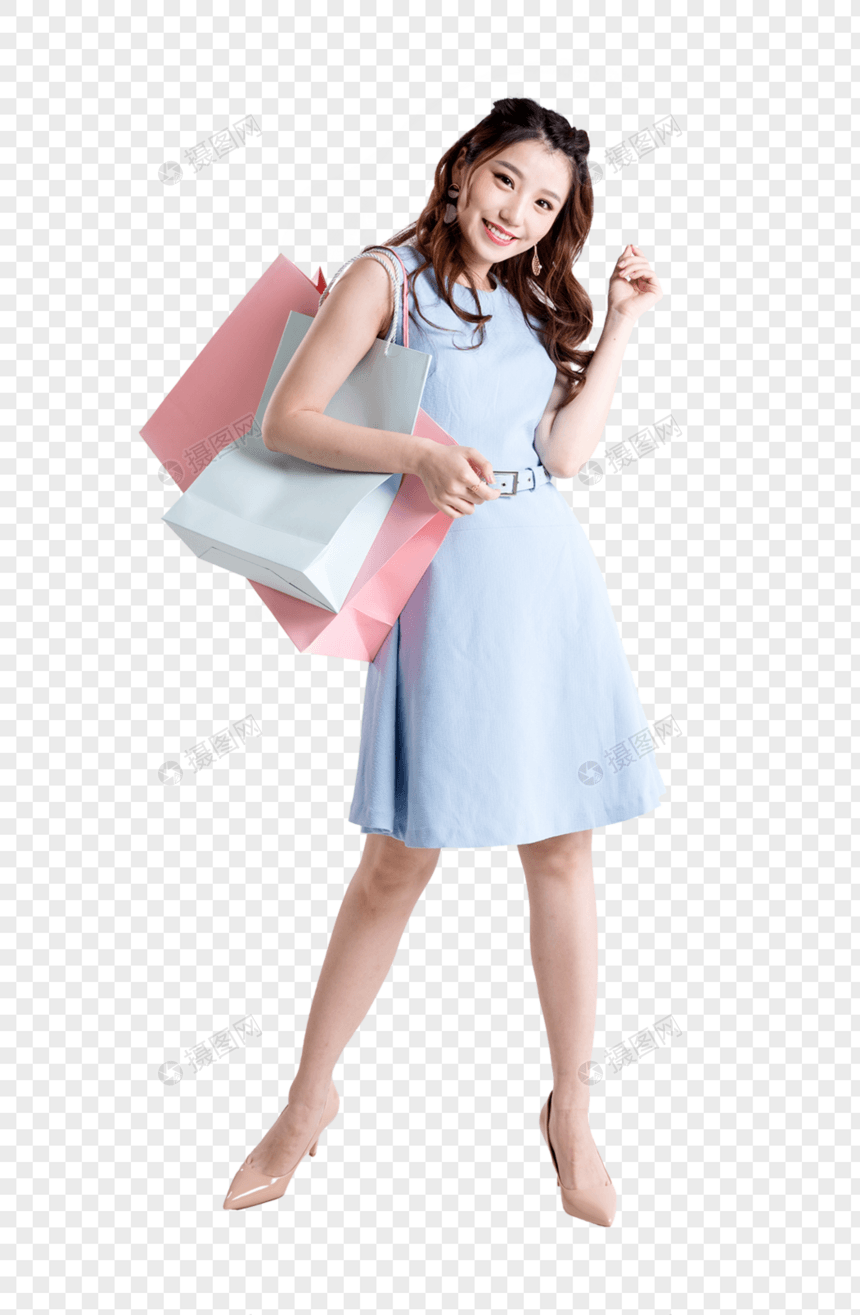 手提购物袋的开心女性图片