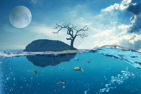 大海小岛和渔船孤岛枯树孤寂背景设计图片