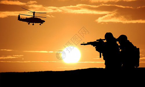 军事对抗夕阳下的军人设计图片