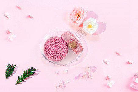 粉色花朵绿植中秋月饼设计图片