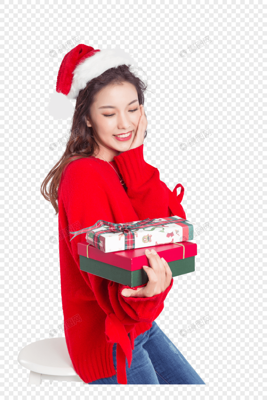 手拿礼物盒的圣诞装扮女性棚拍图片