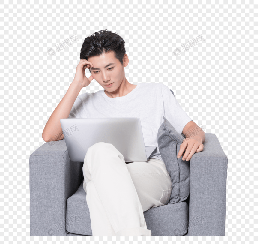 男青年沙发上使用电脑图片