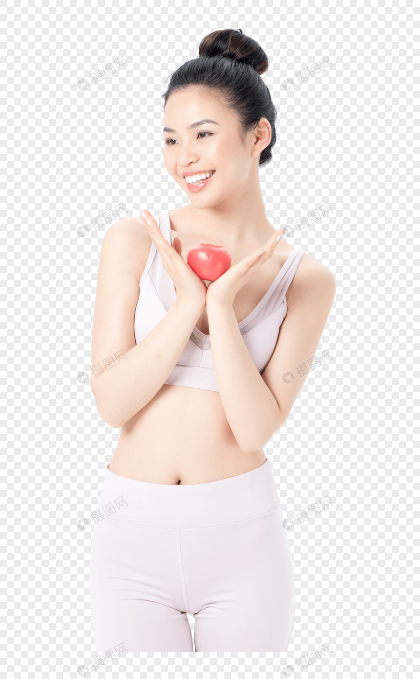 运动健身美女手持西红柿图片