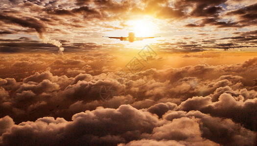 飞机晚霞高空云端背景设计图片