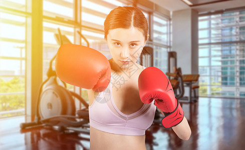 运动健身女性腰腹力量训练年轻女性做拳击运动设计图片