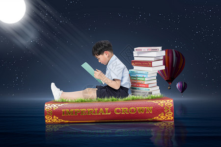 坐在书堆上的小男孩月光下看书的小男孩设计图片
