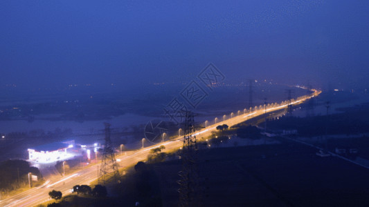 夜景大桥乡村田野中的公路延时GIF高清图片