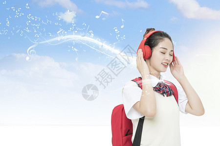 头戴耳机听音乐的女孩享受午餐听音乐的女大学生设计图片