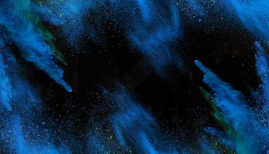 蓝色漂浮粉末喷溅背景设计图片