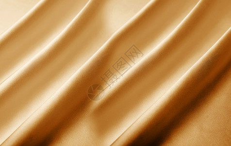 黄金色葡萄球菌金色丝绸背景设计图片