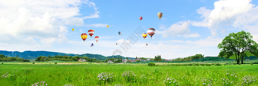 热气球城市草地背景设计图片