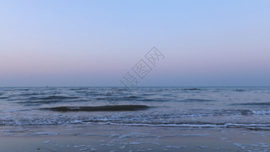 青岛金沙滩水平线的夕阳海边GIF高清图片