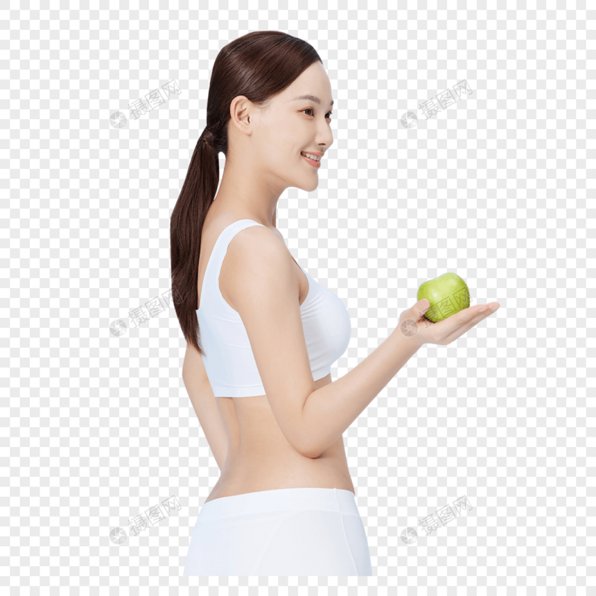 健身美女手拿青苹果展示图片