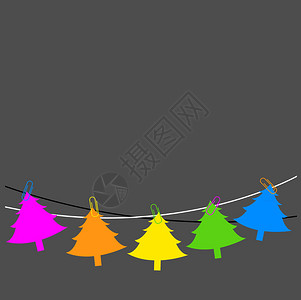 挂在摘要背景上的多彩圣诞树的装饰概图片