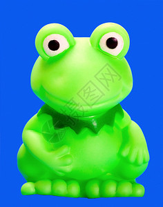 蓝色背景上的绿色青蛙橡胶沐浴玩具图片