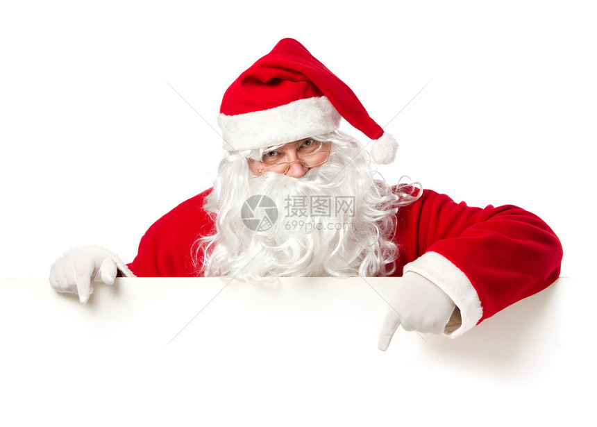 圣诞老人用空白广告横幅指着白色背景与复制空图片