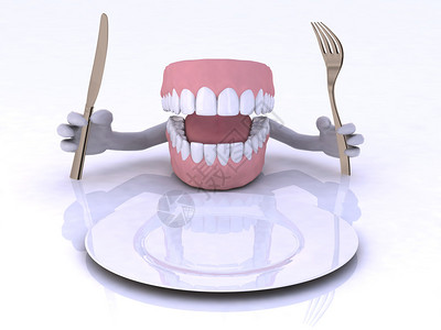 空盘前用手和餐具的假牙图片
