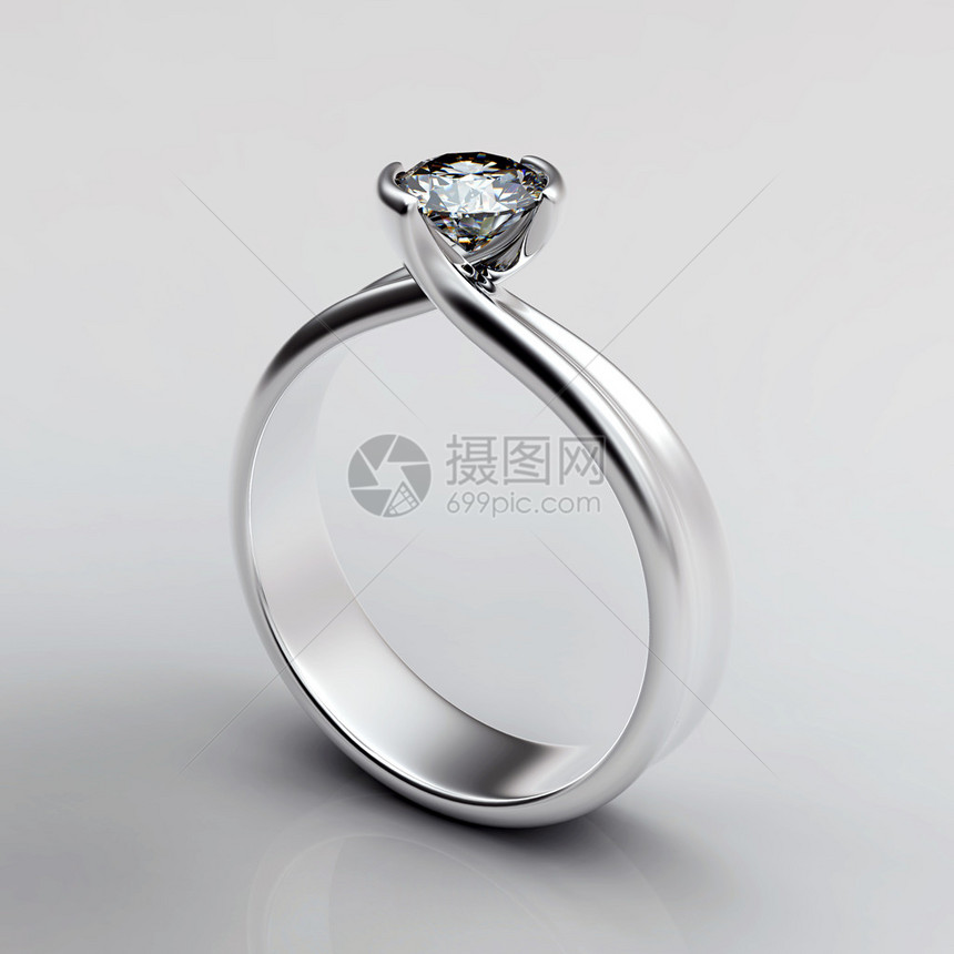 白色背景上镶有钻石的结婚戒指爱的象征图片