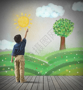 年幼的孩子在一堵灰色的墙上画了一幅绿色的全景图图片