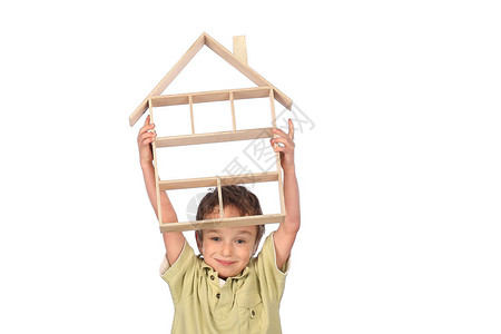 男孩梦想自己的房子在白色背图片