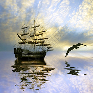 帆船和鸟对美丽的日出景观图片