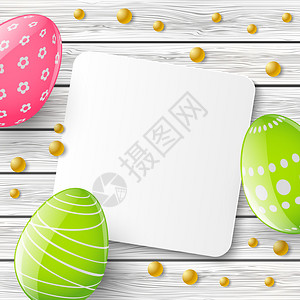 复活节贺卡与木制背景上的彩蛋图片