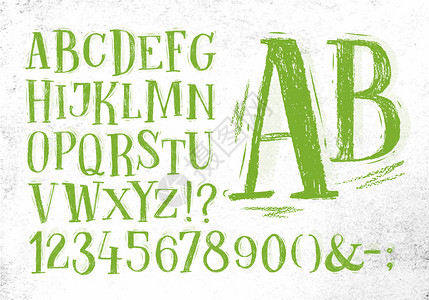字体铅笔老手在脏纸背景上画绿色的字母表图片